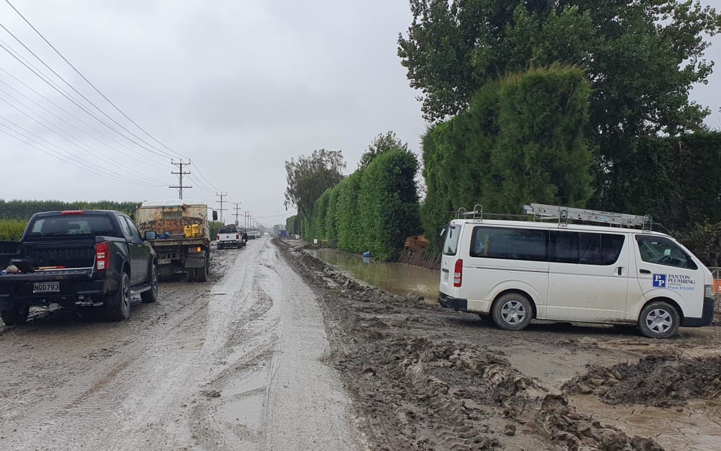Rain turns silt to mud, adding to traveling time, and risks, in Pakowhai.