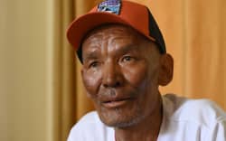 Everest survivor Dawa Sherpa speaks during an interview with AFP in Kathmandu on June 18, 2026. Dawa, a Nepali mountaineer who spent six days dragging himself off Mount Everest after being abandoned has been moved out of intensive care as he slowly recovers, his family said on June 9. (Photo by Prakash MATHEMA / AFP)
