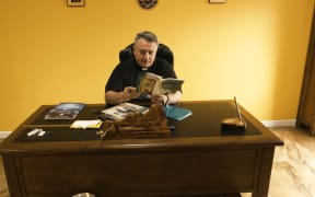 Auckland-based Father Douglas Al-Bazi was kidnapped and tortured by Islamic terrorists, before running a refugee centre for thousands of people fleeing religious persecution and threats of brutal murder.