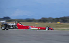 The jet-powered dragster reached a top speed of 458.2 km/h.