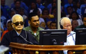 Former Khmer Rouge leader "Brother Number Two" Nuon Chea (L) and former Khmer Rouge head of state Khieu Samphan (R) sitting in the courtroom at the ECCC in Phnom Penh.