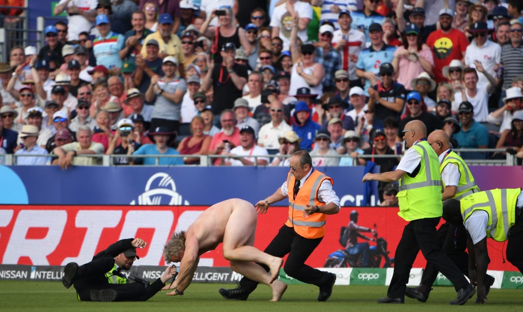 A streaker disrupts play during the Cricket World Cup fixture between England and New Zealand.