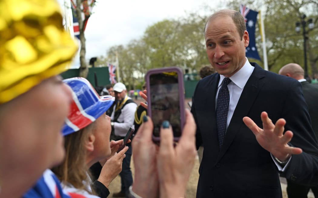 Prince William, Prince of Wales speaks with well-wishers on The Mall near to Buckingham Palace in central London, on 5 May, 2023, ahead of the coronation weekend.