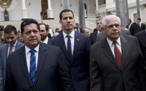 FILE - In this Jan. 5, 2019 file photo, incoming National Assembly Vice President Edgar Zambrano, left, arrives with incoming National Assembly President Juan Guaido, center, and Omar Barboza, outgoing president of Venezuela's National Assembly,