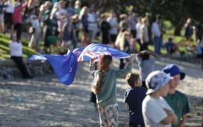 America's Cup fans celebrating at Takapuna.