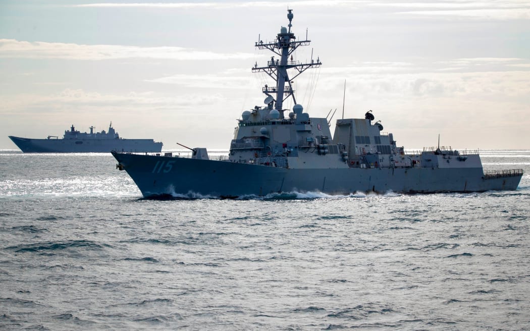 (l-r) HMAS Canberra and USS Rafael Peralta conduct maritime manoeuvres off the coast of Queensland, during Exercise Talisman Sabre 2021.