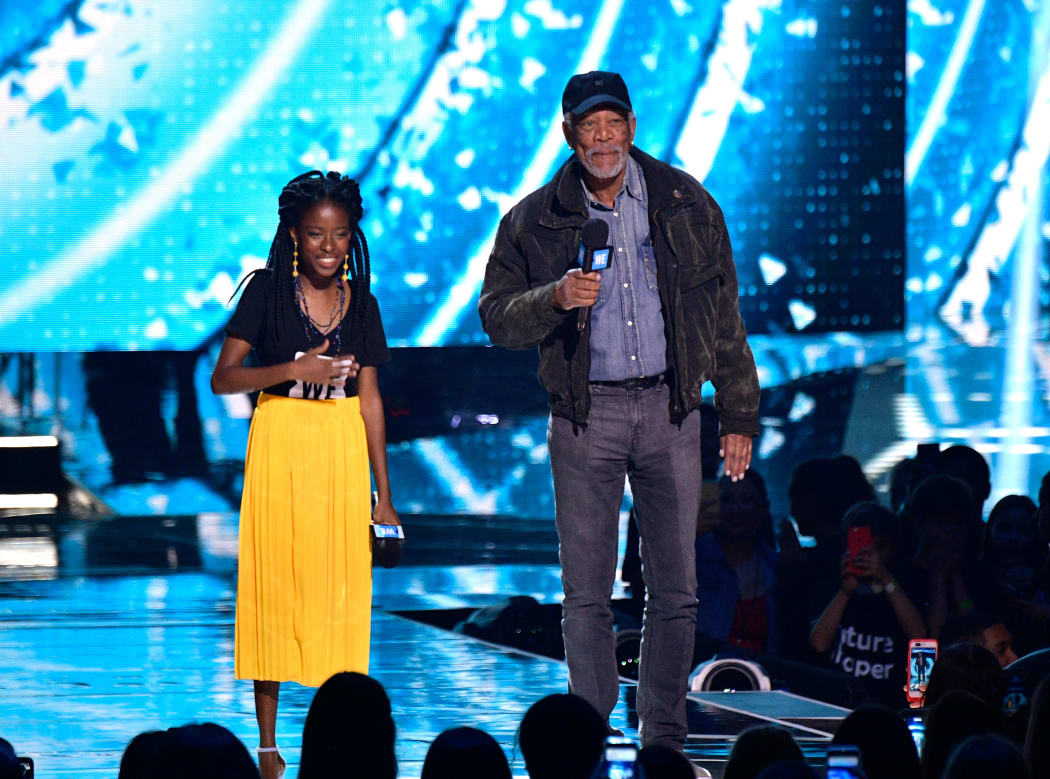 Amanda Gorman pictured with actor Morgan Freeman in 2018, became LA's youth poet laureate at 16.