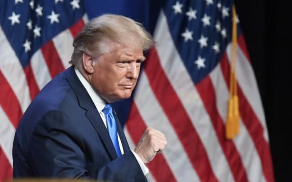 US President Donald Trump waves to the crowd on the first day of the Republican National Convention at the Charlotte Convention Center on August 24, 2020.   David T. Foster III-Pool/Getty Images/AFP