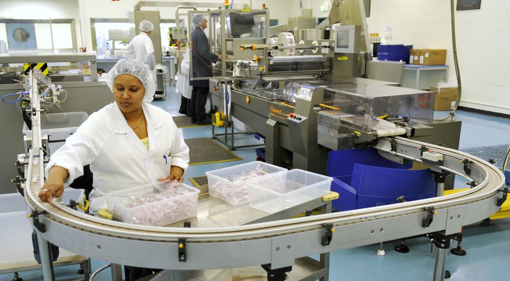An employee of vaccine manufacturer CSL, works on the production for the swine flu vaccine in Australia.