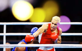 David Nyika of New Zealand competes against Cheavon Clarke of England at the Men's 91kg Semifinal.