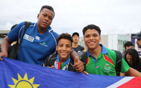 Kauaa Katjirua (l), Levalle Underhell (r) and friend at the New Zealand v Namibia game at Tokyo Stadium on Sunday