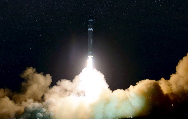 A photo released by North Korea's official Korean Central News Agency (KCNA) shows launching of the Hwasong-15 missile.