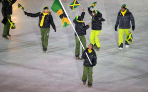 The Jamaican team march at the 2018 Winter Olympics opening ceremony.