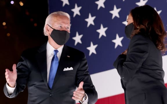 Democratic presidential nominee Joe Biden and Democratic Vice Presidential nominee Kamala Harris confer on stage outside the Chase Center after Biden delivered his acceptance speech  in Wilmington, Delaware.