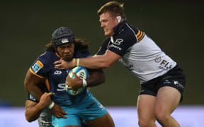 PUKEKOHE, NEW ZEALAND - APRIL 19: Danny Toala of Moana Pasifika is tackled during the round 10 Super Rugby Pacific match between Moana Pasifika and the ACT Brumbies at Navigation Homes Stadium, on April 19, 2025, in Pukekohe, New Zealand. (Photo by Phil Walter/Getty Images)