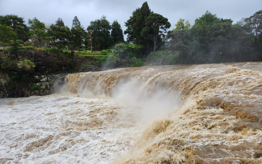 Floodwaters thunder over Haruru Falls, near Paihia in the Bay of Islands on 30 October, 2023.