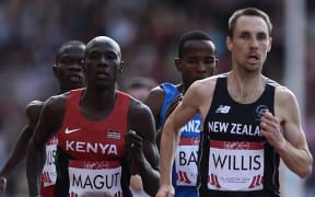 (L-R) Kenya's James Kiplagat Magut and New Zealand's Nick Willis compete in the heats the men's 1500m athletics event at Hampden Park during the 2014 Commonwealth Games in Glasgow, Scotland on August 1, 2014.