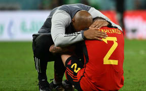 Belgium's French assistant coach Thierry Henry hugs Belgium's defender Toby Alderweireld after their exit from the 2022 World Cup.