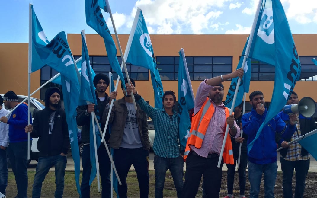 Car groomers from 2Cheap Cars protest outside their work in East Tamaki.