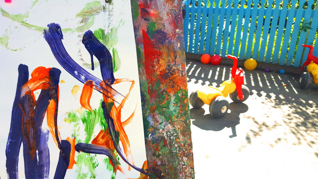 Painting and tricycle at early childhood centre