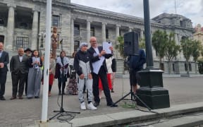 Labour MP Phil Twyford holding the petition which has been signed by more than 16,000 people urging the government to provide urgent humanitarian assistance to the Palestinian people.