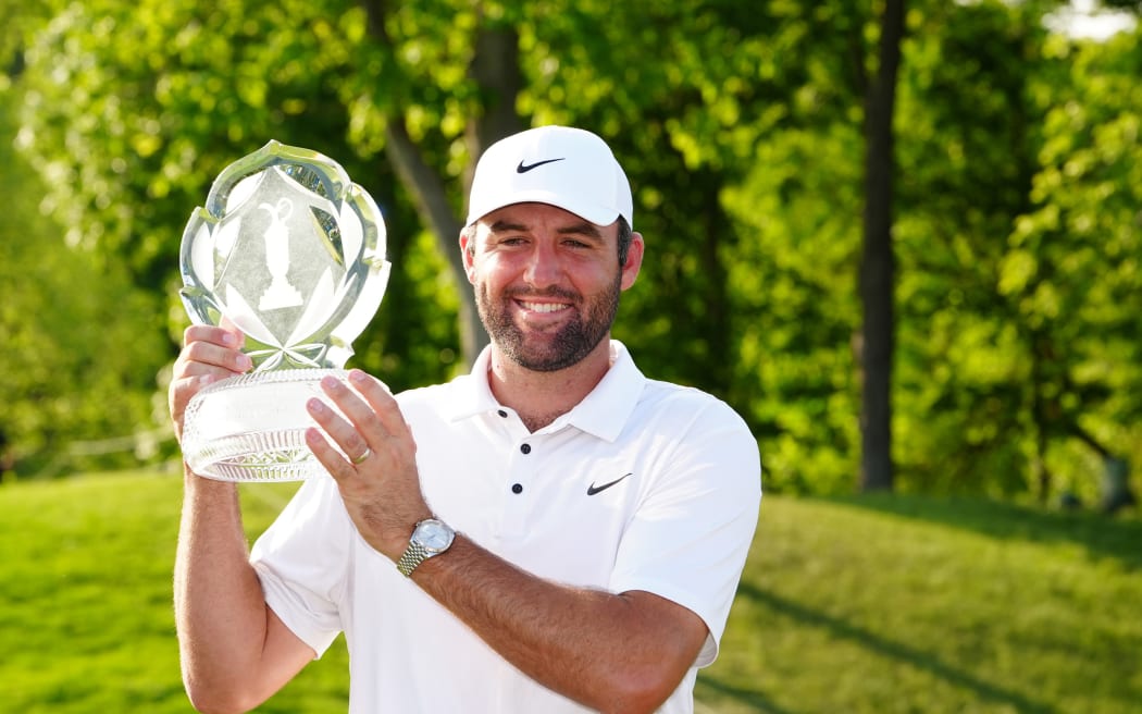 Scottie Scheffler poses with the trophy after winning the Memorial Tournament at Muirfield Village Golf Club in Dublin, Ohio.  1 June, 2025. (Photo by Brian Spurlock/Icon Sportswire)