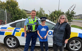 Ryan and Kathie with Sergeant Fleming at the Pokeno station.