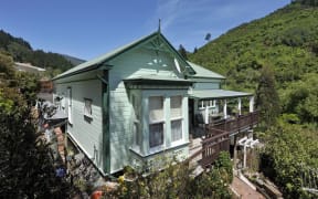 A 1900s villa with a wraparound deck at 331 Brook Street is one of the 10 relocatable homes being sold by Nelson City Council. Trade Me.