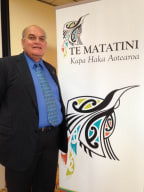 Te Matatini chairman, Selwyn Parata, next to the organisation's new brand.