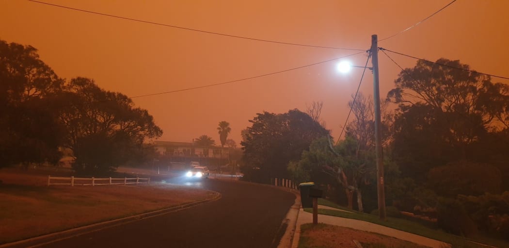 Tathra, New South Wales as bush fires blaze nearby.