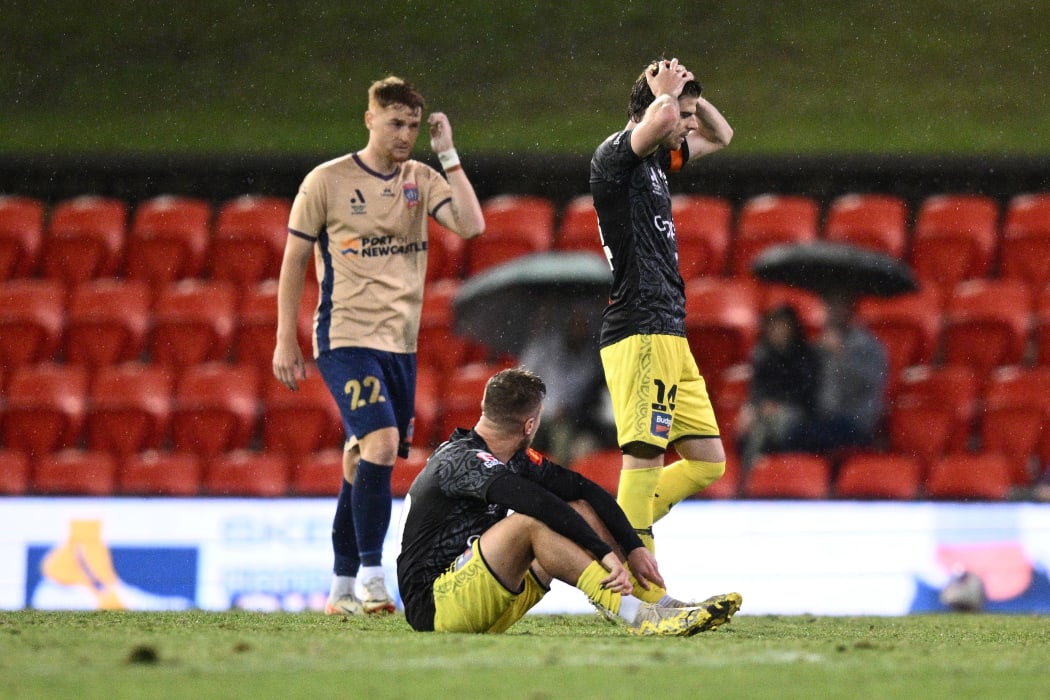 Alex Rufer, of the Wellington Phoenix leads the team out during