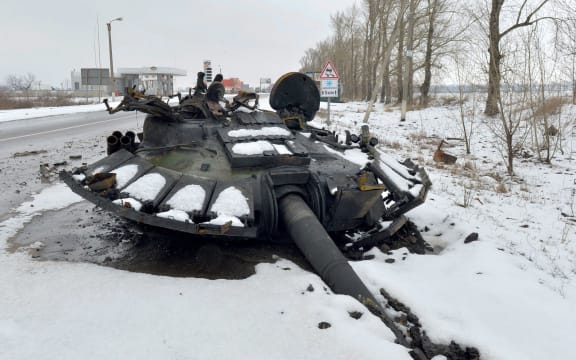 TOPSHOT - A fragment of a destroyed Russian tank is seen on the roadside on the outskirts of Kharkiv on February 26, 2022, following the Russian invasion of Ukraine.