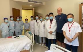 Stu Lye with hospital staff in China where he underwent CAR T-cell therapy.