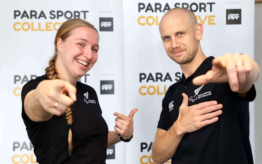 Para athlete Siobhan Terry (L) and Jack Cooper, Paralympics New Zealand, Para Cycling Development coach (R) pose during the official 'Para Sport Collective launch at AUT Millennium Institute.