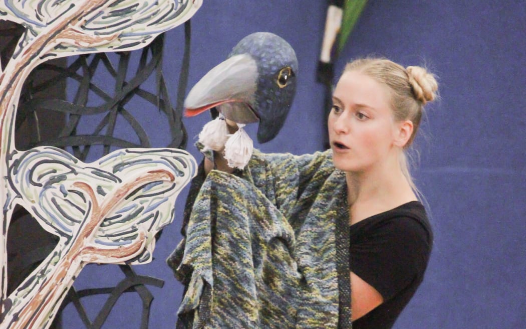 Alexandra Francis Opera in Schools, women holding bird puppet in the air.