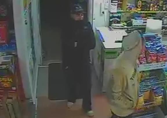 The other suspect follows him in.