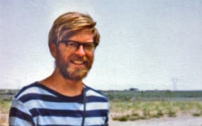 John Flux in Iran in 1977 with a road kill hare