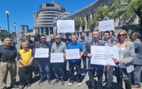 Members of pro-democracy group New Zealand Values Alliance submit a petition to Parliament that calls for an inquiry into China’s foreign interference activities in New Zealand and the Pacific region on 10 December 2024.