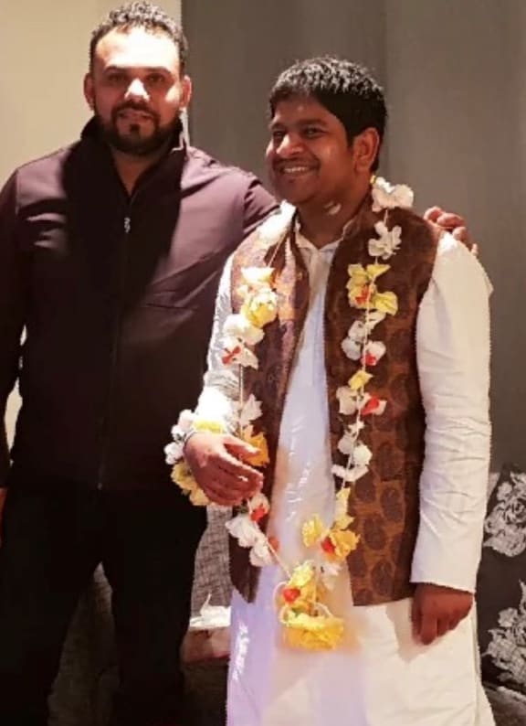 Mohammad Khaja Mohiuddin with his friend, Imran Khan (left), who was killed in the attack on Christchurch mosques last year.