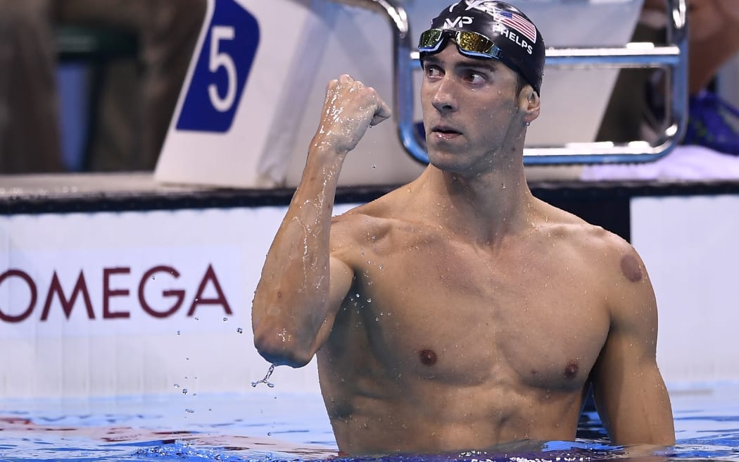 Michael Phelps celebrates after winning the Men's 200m Butterfly Final during the swimming event at the Rio 2016 Olympic Games.