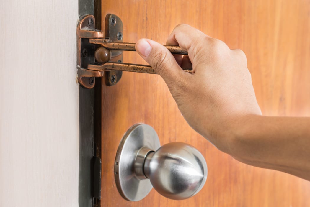 Female hand on handle, opening or closing door