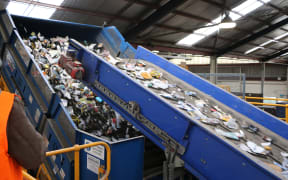 Fresh off the truck, recycling going onto the first conveyor belts to begin the sorting process at Oji.