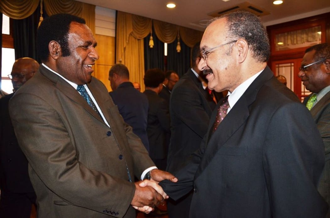 Minister for Labour and Industrial Relations and Member for Tambul-Nebilyer Benjamin Poponawa (left) with Prime Minister Peter O'Neill.