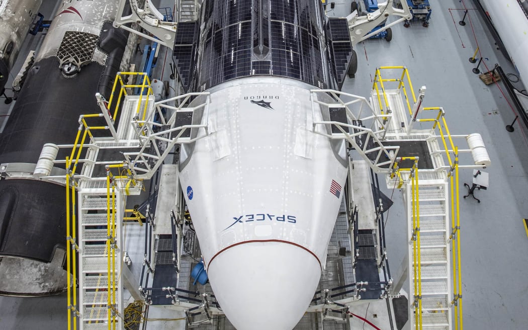 In this image released by Space X, the Crew Dragon spacecraft and the SpaceX Falcon 9 rocket are pictured at Launch Complex 39A on May 21, 2020, as preparations continue for the Demo-2 mission at NASA's Kennedy Space Center in Florida.