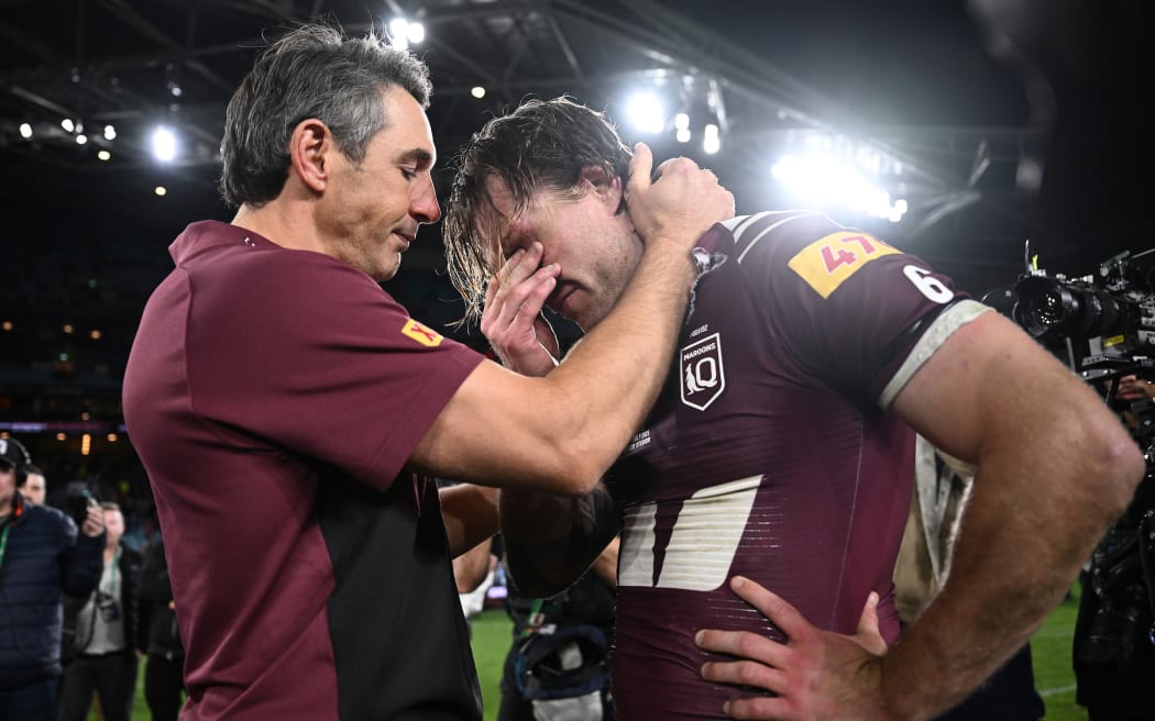 Maroons head coach Billy Slater and captain Cameron Munster share a very emotional moment following their win over the Blues in the State of Origin game three match between the Queensland Maroons and the New South Wales Blues at Accor Stadium in Sydney, Wednesday, July 9, 2025. (AAP Image/Dan Himbrechts/Photosport)