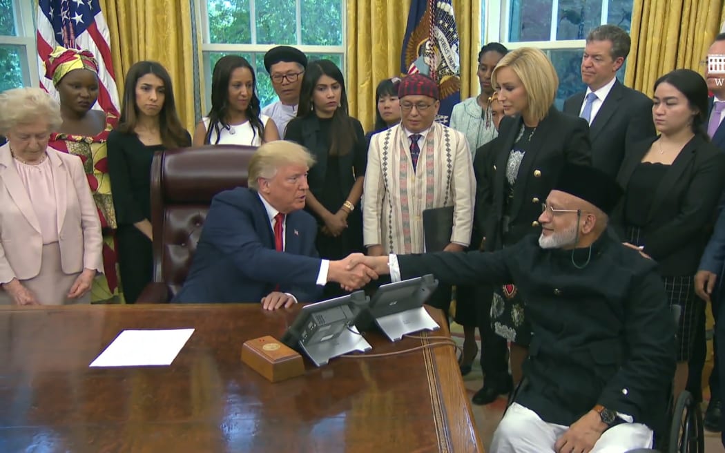 US President Donald Trump meeting with Christchurch mosque shooting survivor Farid Ahmed.