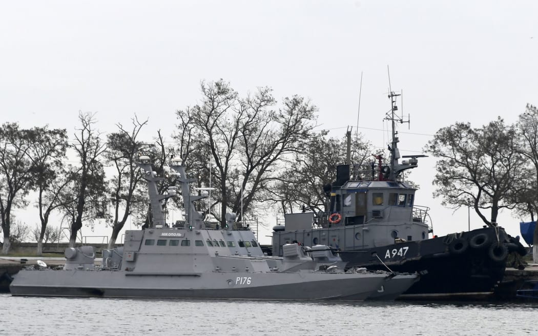FILE - In this Monday, Nov. 26, 2018 file photo, three Ukrainian ships are docked near the Kerch after been seized on Sunday, in Kerch, Crimea.