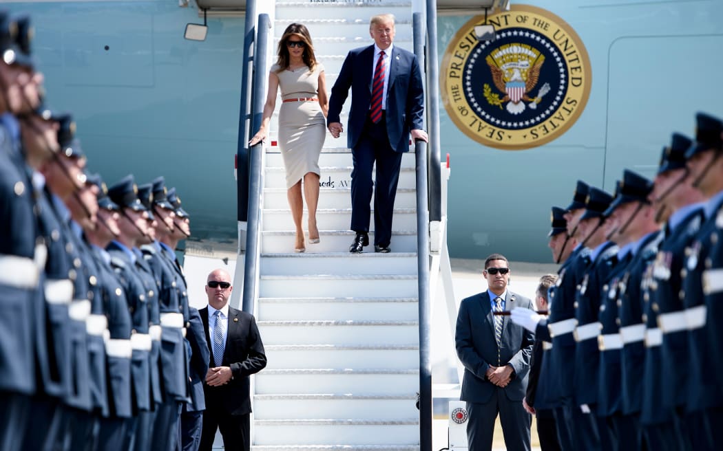 Melania and Donald Trump disembark Air Force One at Stansted Airport, north of Londo.