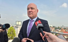 Christopher Luxon speaks with media in Laos