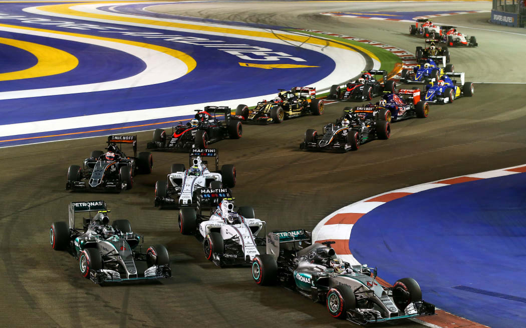 Racecars were forced to slow down when a man took to the track at this weekend's Singapore Grand Prix.